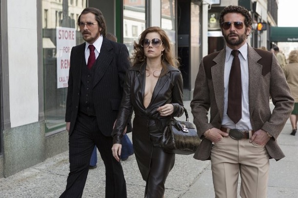 'American Hustle' review: Christian Bale (Irving Rosenfeld), Amy Adams (Sydney Prosser) and Bradley Cooper (FBI agent Richie DiMaso) in American Hustle