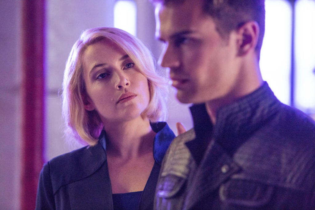 Kate Winslet (Jeanine) with a nefarious look in her eye concerning Theo James (Four) in Divergent