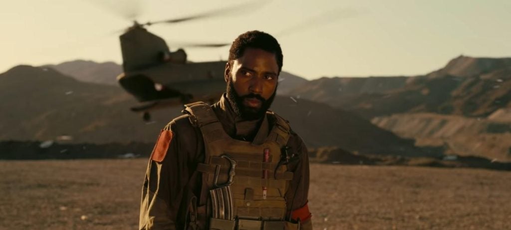 John David Washington as The Protagonist looking emotional as he says goodbye to present-day Neil